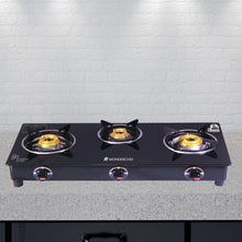 Load image into Gallery viewer, Ultima 3 Burner Manual Glass Cooktop | 6mm Toughened Glass Cooktop | Stainless Steel Drip tray | Anti-Skid Legs | Large Pan support | Manual Ignition | 360 degree Revolving Nozzle | Black steel frame | 2 Year Warranty | Black